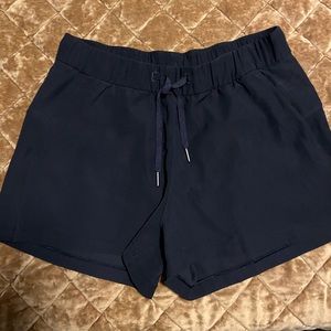 Lululemon On The Fly-woven black shorts Size 8